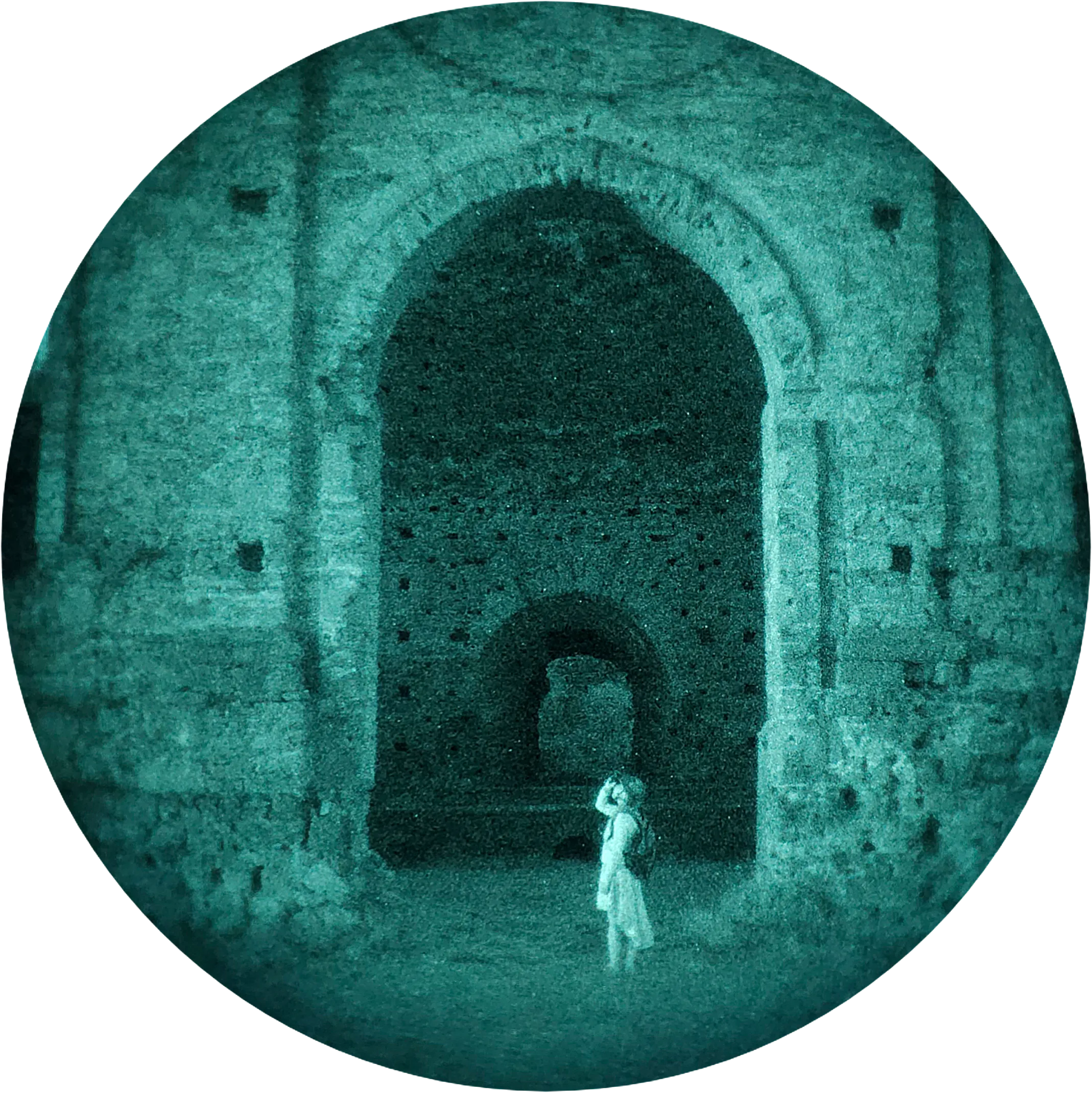 Night-trip participant in the ruins of a stone building, seen through night-vision goggles