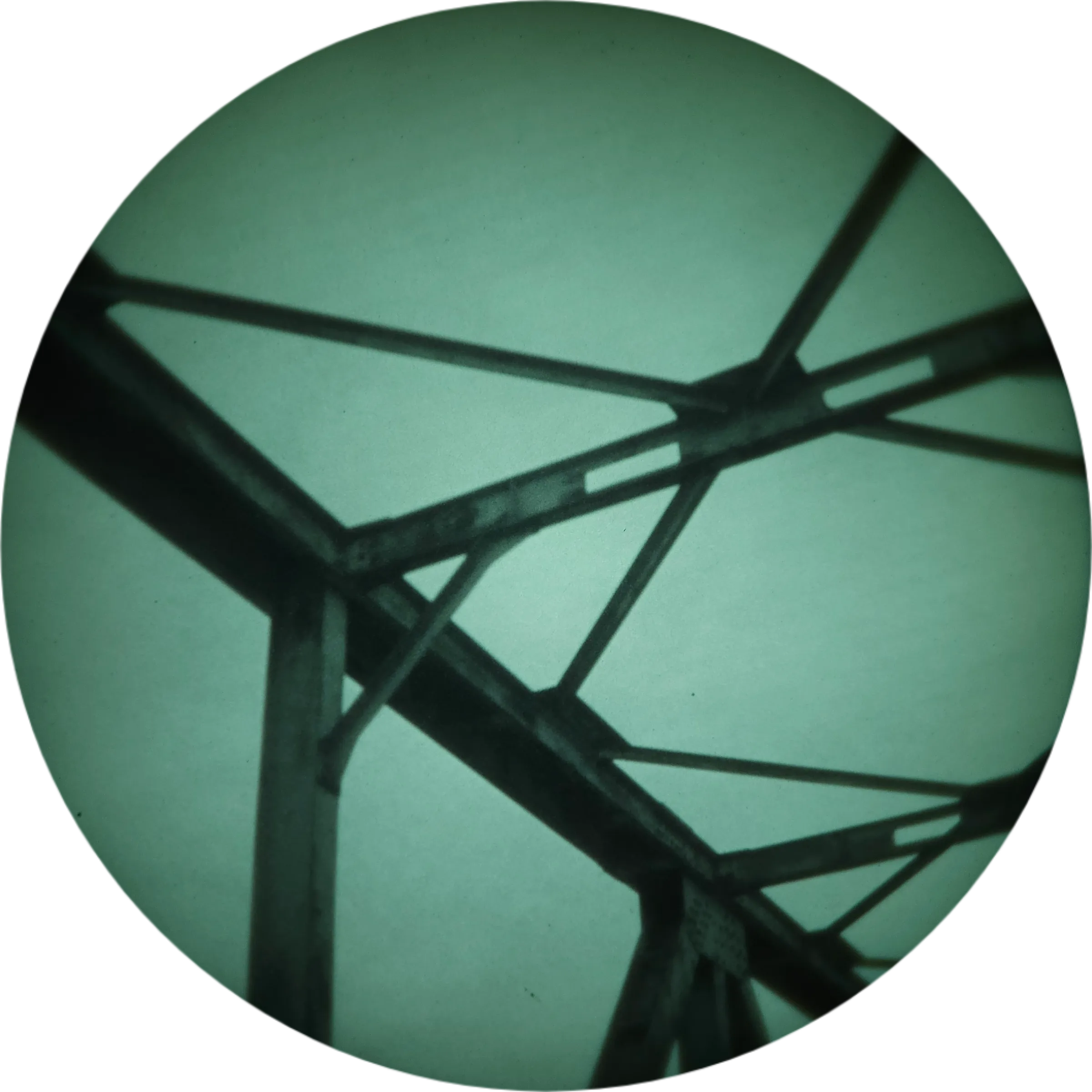 Close-up of steel bridge trusses and joints, seen in night vision