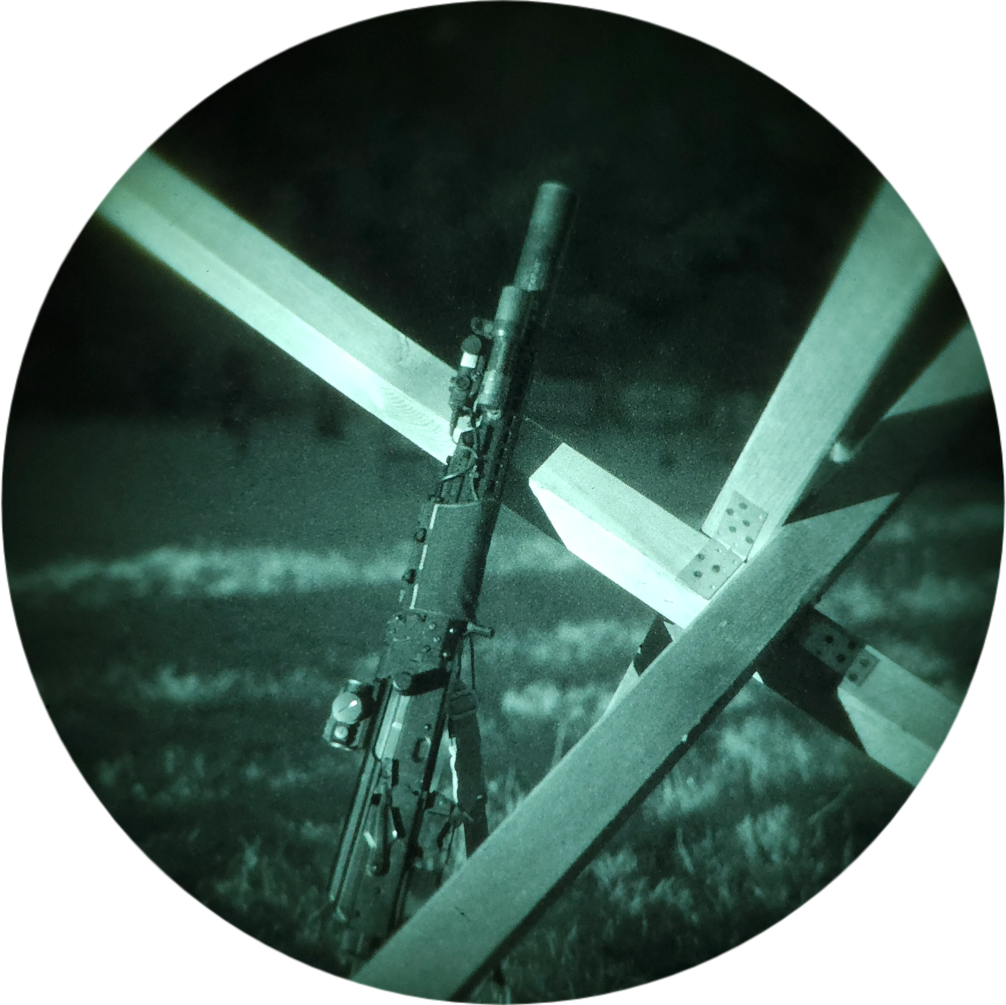 Two-person team in full tactical gear with rented night vision, prone position in the field