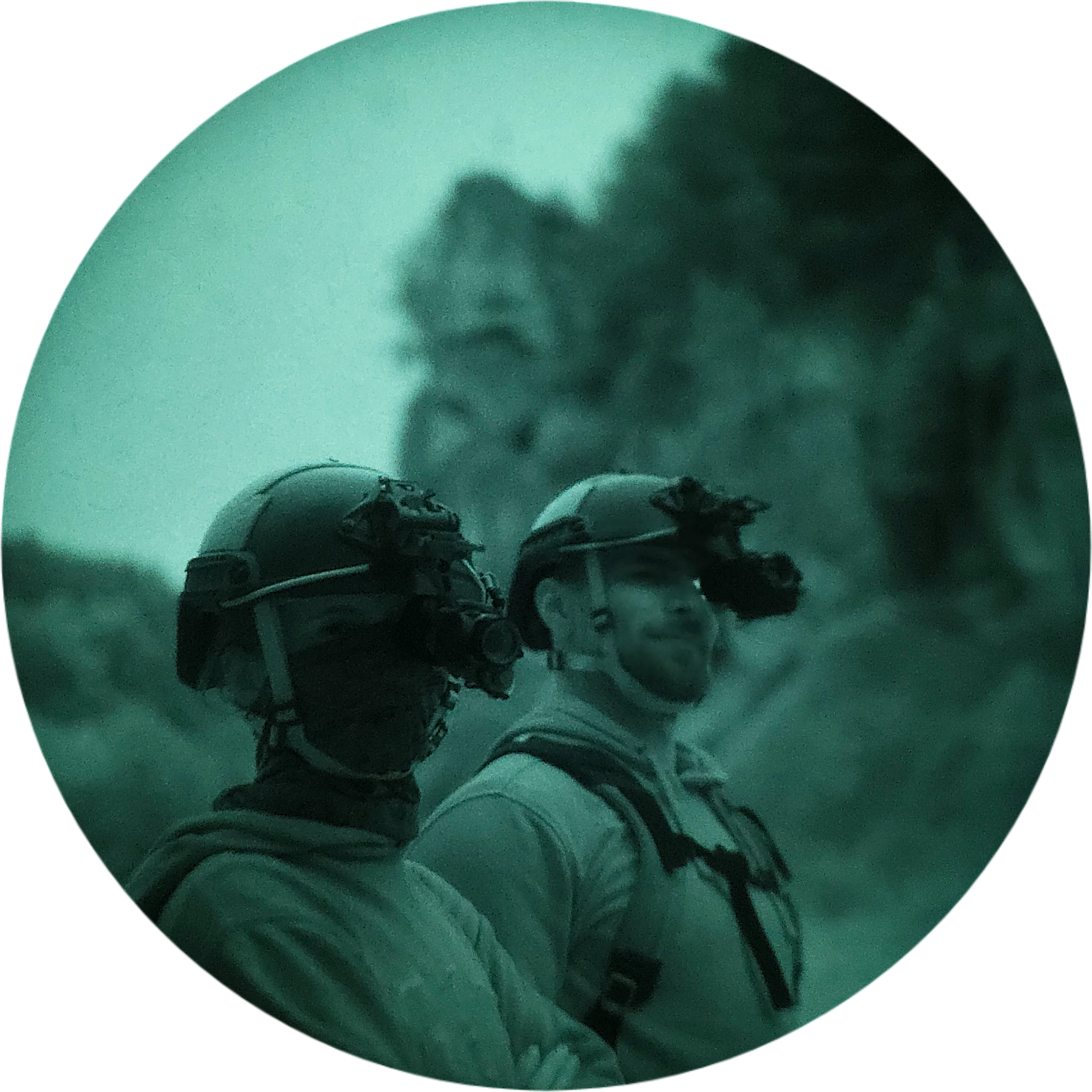 Two trip participants with night vision mounted on their helmets