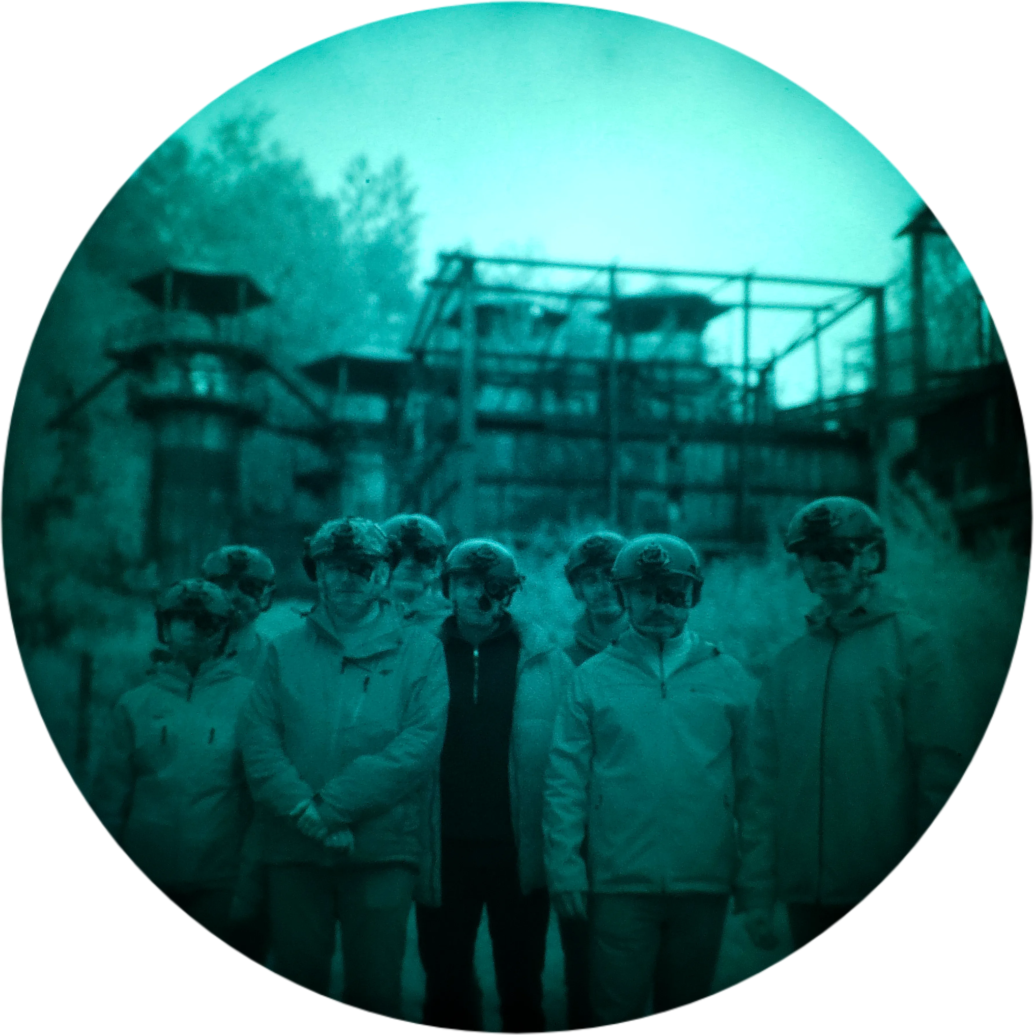 Group of trip participants in helmets against the ruins of the Liban Quarry