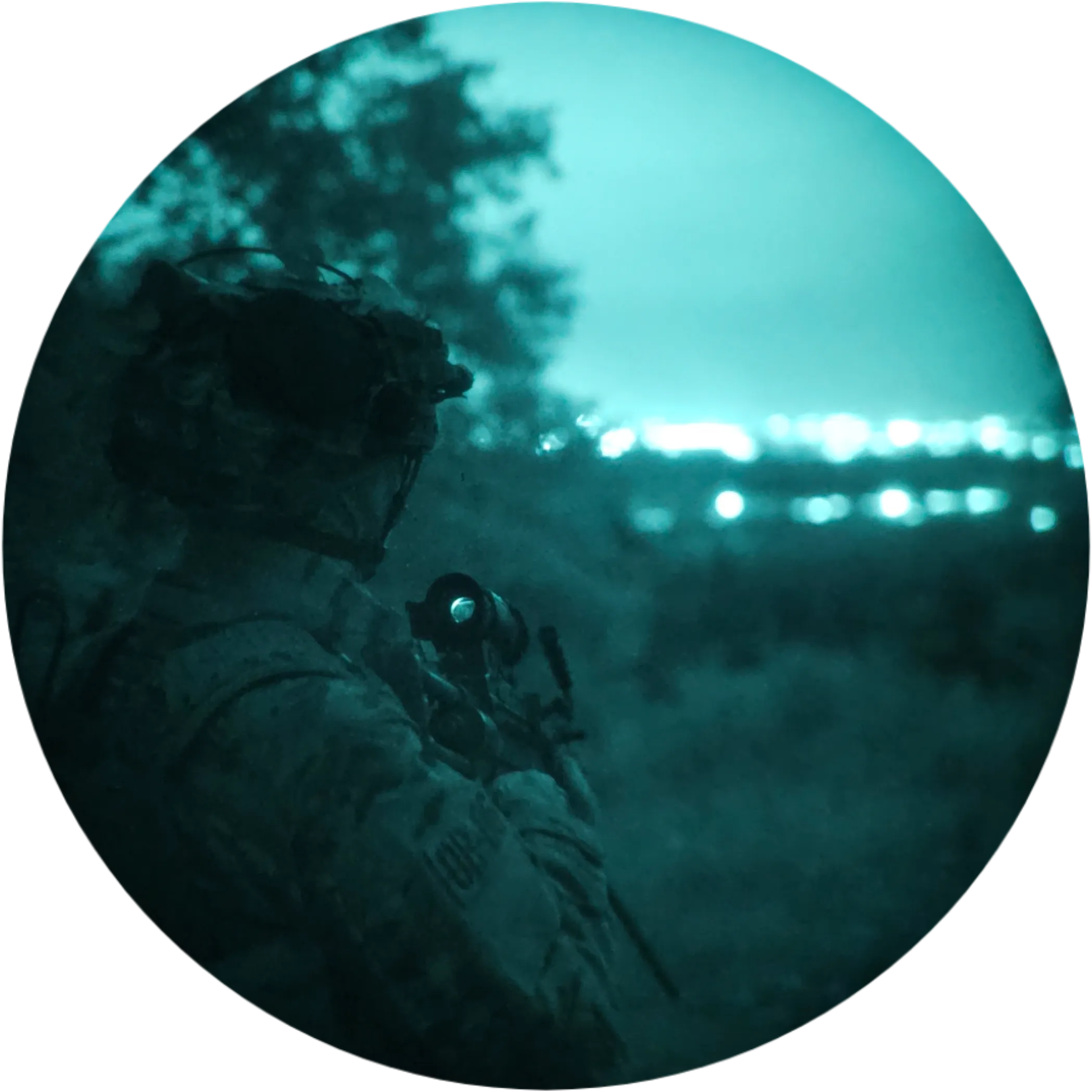 Person with a rented replica weapon and helmet-mounted night vision looking over a valley with city lights in the distance