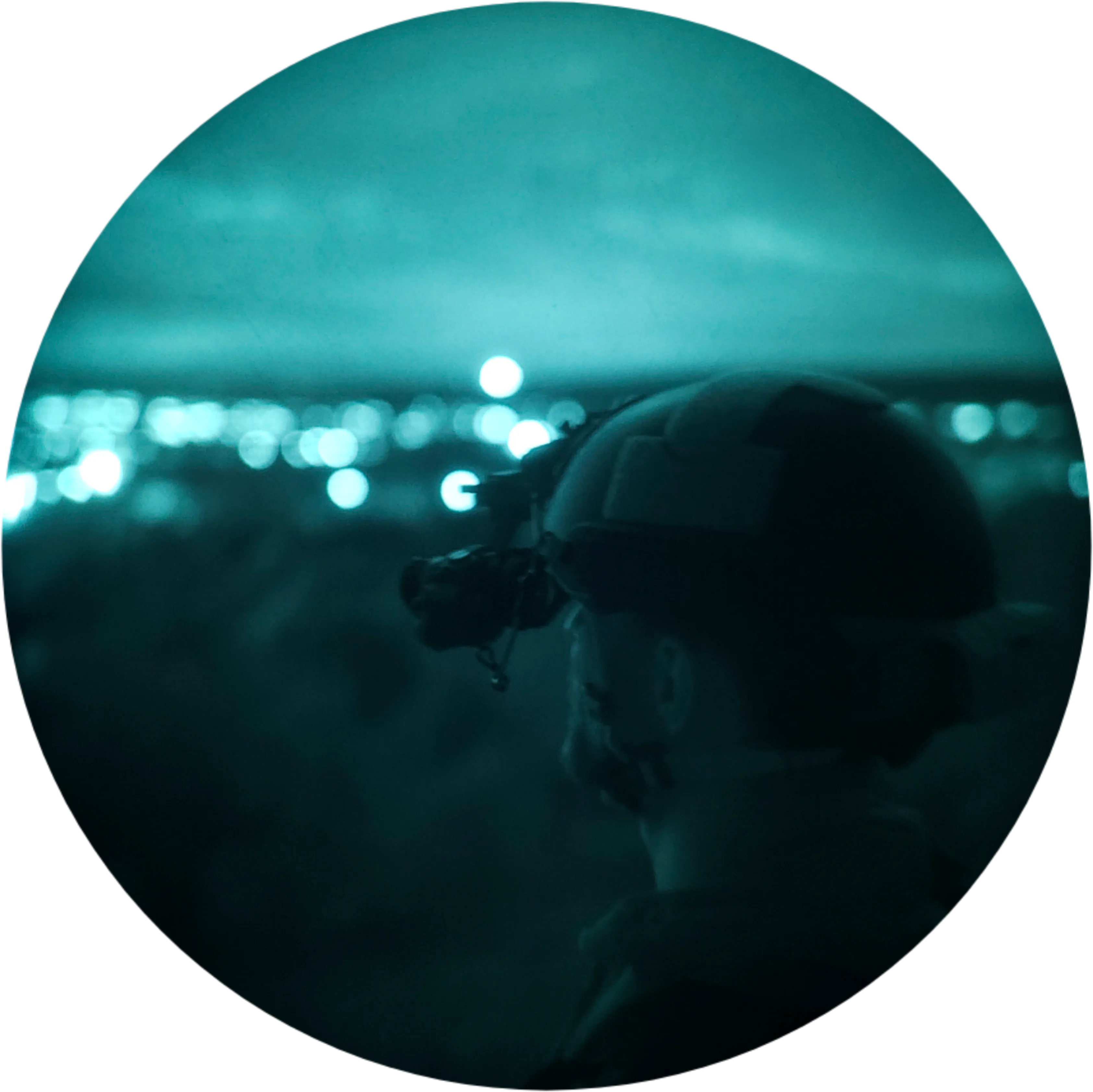 Aerial night view of a valley, silhouette of a person in the foreground