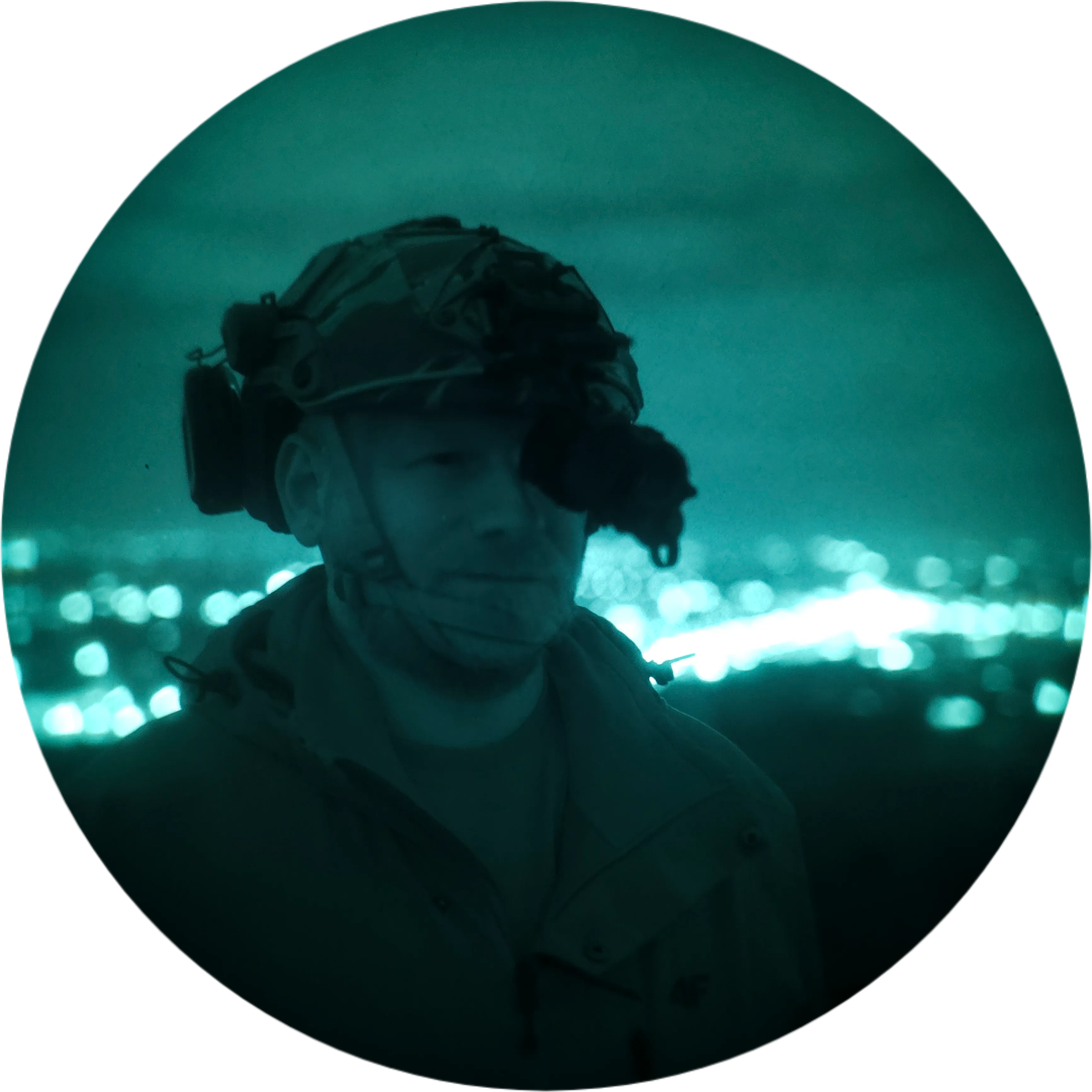 Night-trip participant looking at the city skyline through night-vision goggles